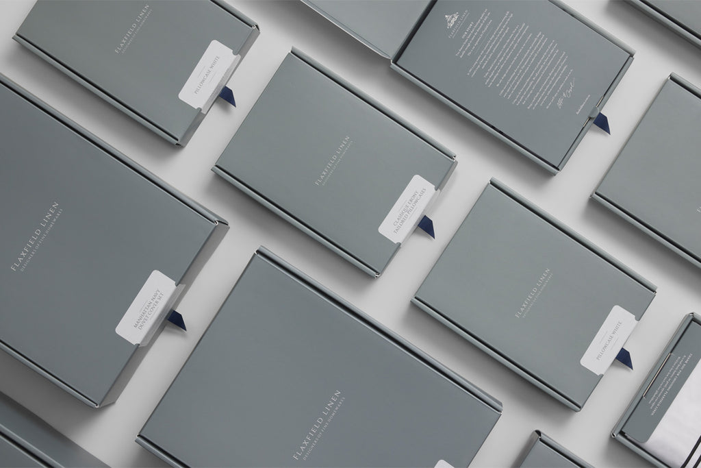 Elegant Flaxfield Linen gift box packaging for the Manhattan Bedding Collection, showcasing the sophisticated navy and white box design, perfect for luxury gifting.