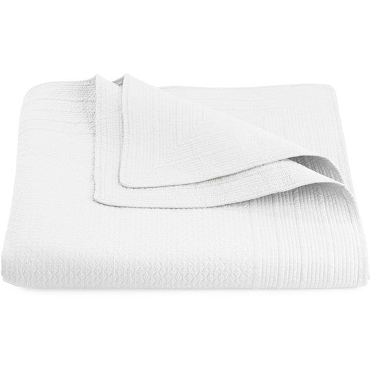 Resort white quilted bedspread in cotton percale showing stitched border detail