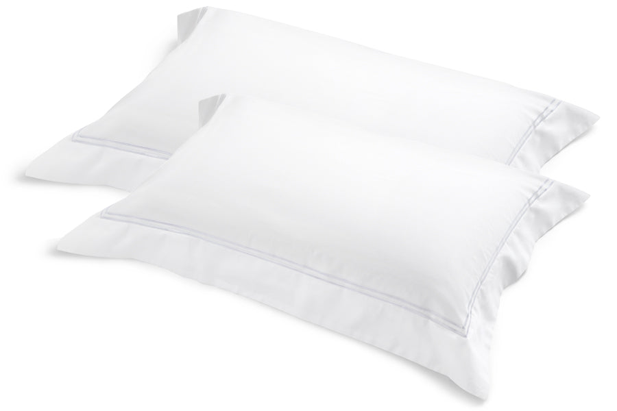 Classique King Pillowcases in white cotton sateen with dual white satin-stitch embroidery, set of two on a white background