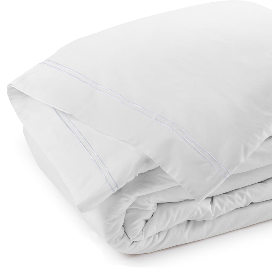 Folded white Classique duvet cover highlighting dual satin-stitch embroidery and 400TC cotton sateen fabric.